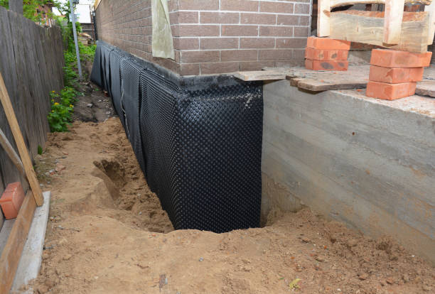 SJ Waterproofing Pros technician performing targeted Waterproofing assessment in Bay Village, OH